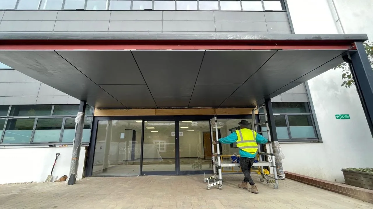 Commercial flat roof canopy installation by Phoenix Roofing
