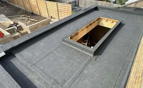 New felt flat roof with Velux skylight opening, installed by Phoenix Roofing
