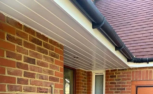 New black guttering and white soffits installed by Phoenix Roofing