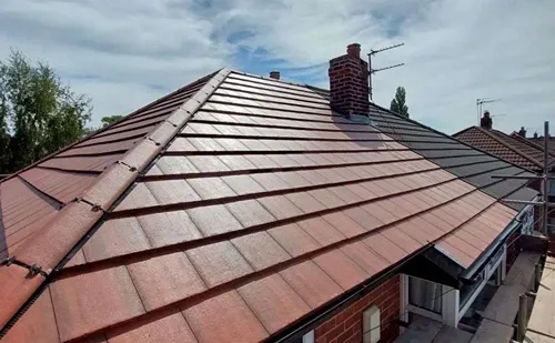 Completed new red tile roof installed by Phoenix Roofing