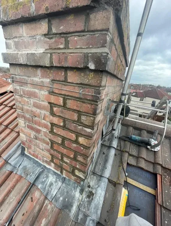 Customer photo: repointed chimney stack with new leadwork by Phoenix Roofing